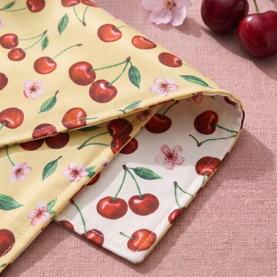 A Cherry Pop bandana folded back to show both printed sides