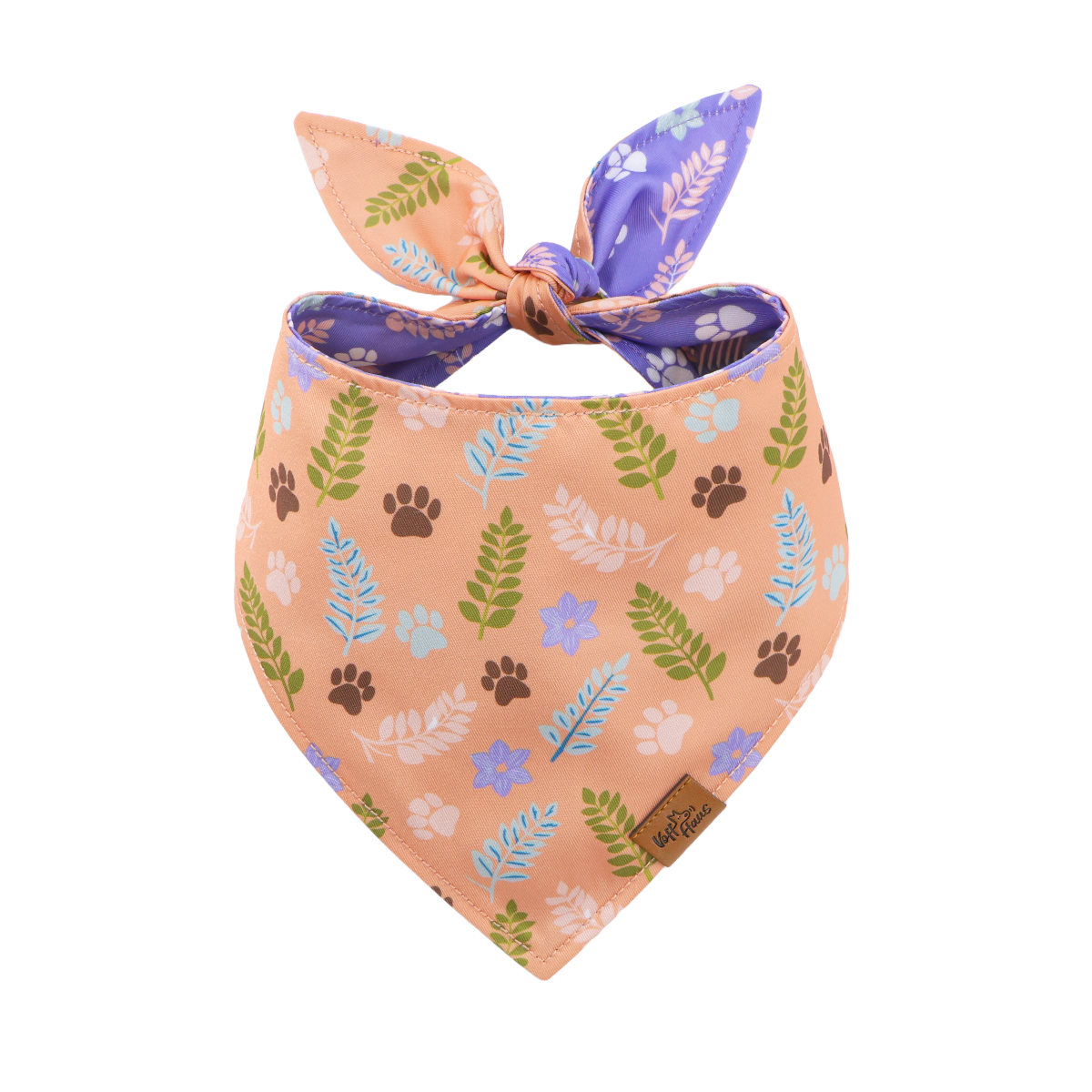 Dog bandana with floral and paw print pattern on a white background
