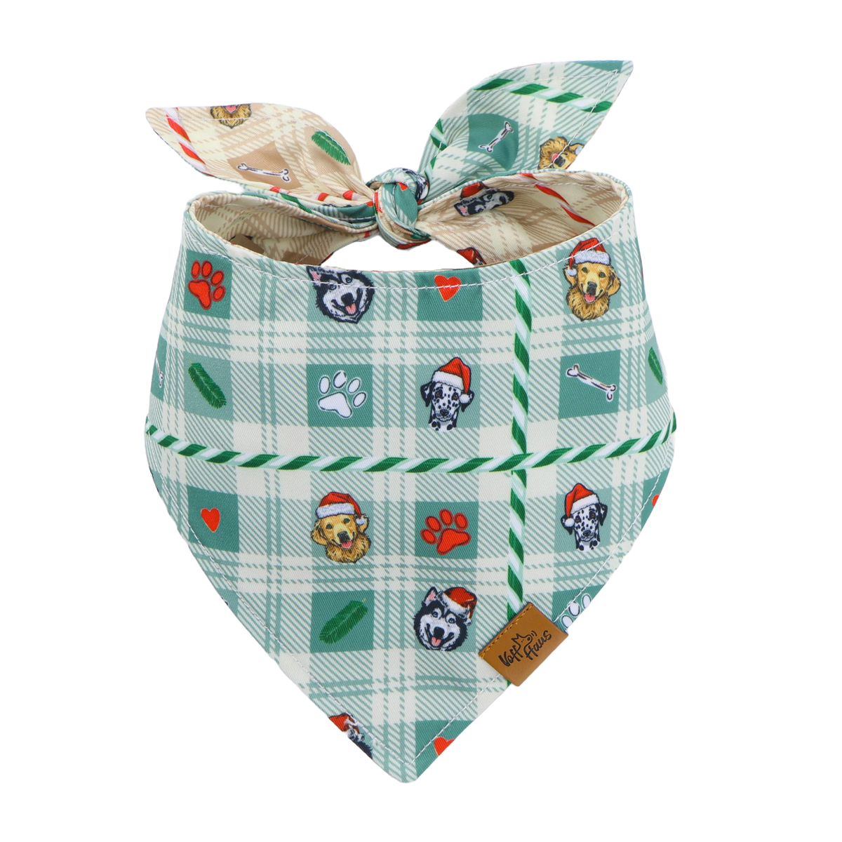 The Candy Cane Tails reversible dog bandana tied flat, mint green side with Santa pups and paw prints