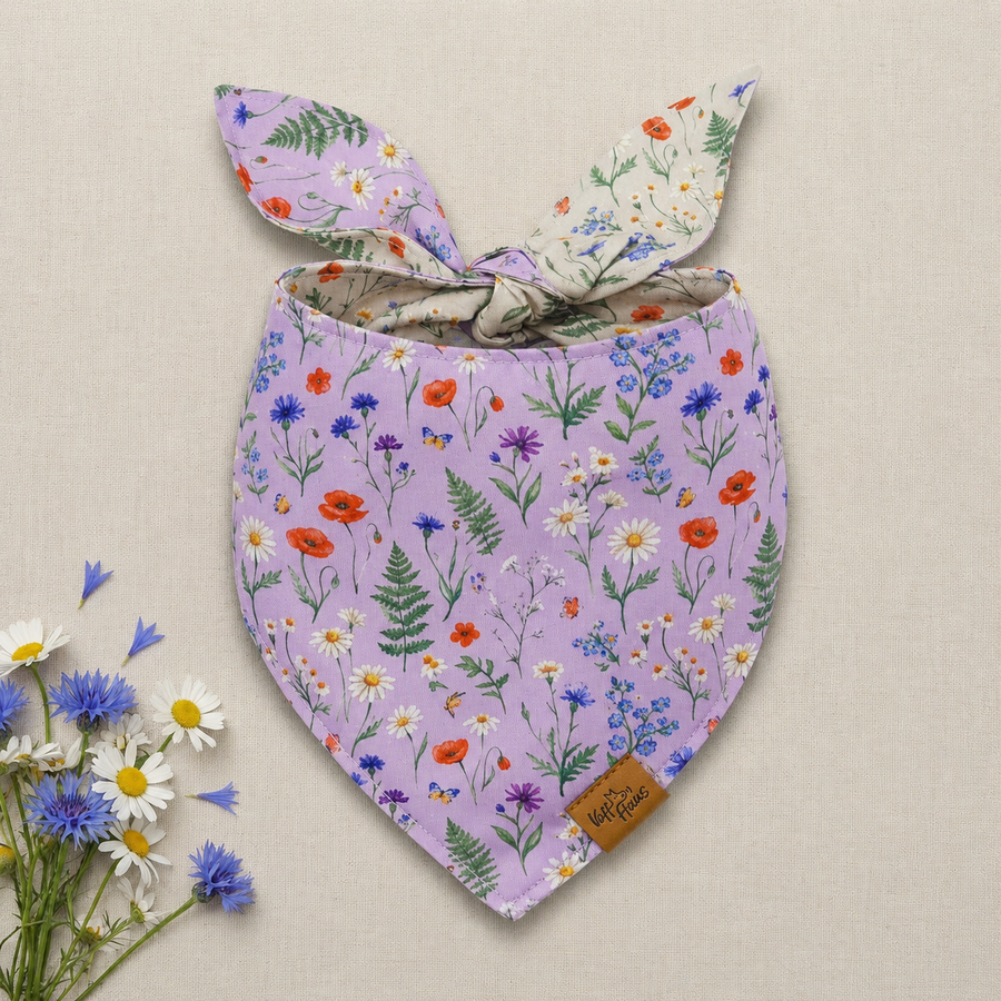 The Wildflower Meadow reversible dog bandana tied flat, lavender side with poppies and cornflowers