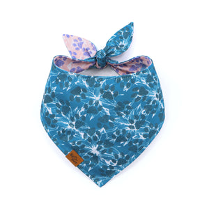 Blue floral bandana with a pink and purple pattern on a white background