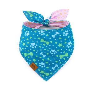 Blue dog bandana with colorful patterns on a white background