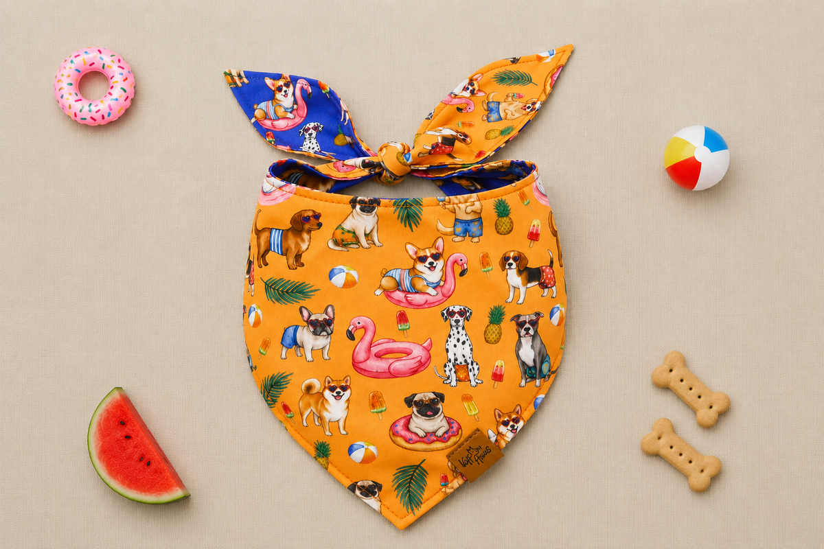 The Pool Pawty reversible dog bandana tied flat, tangerine side with pups on flamingo floats