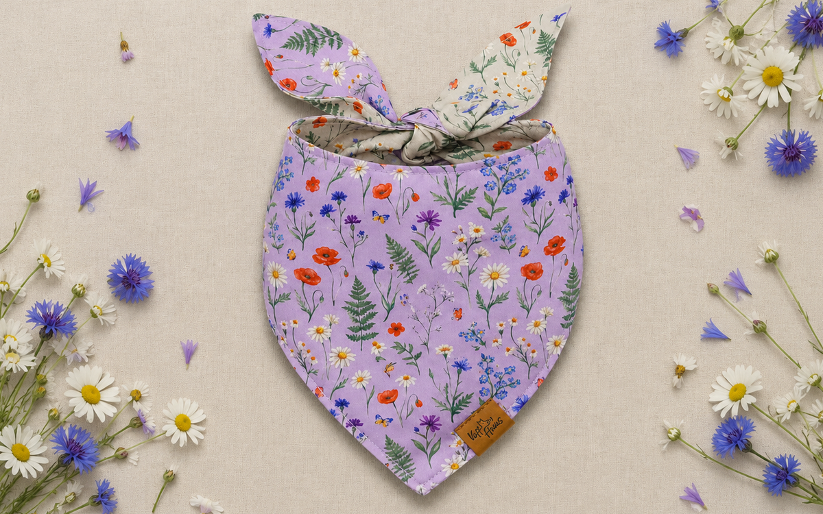 The Wildflower Meadow reversible dog bandana tied flat, lavender side with poppies, cornflowers and daisies