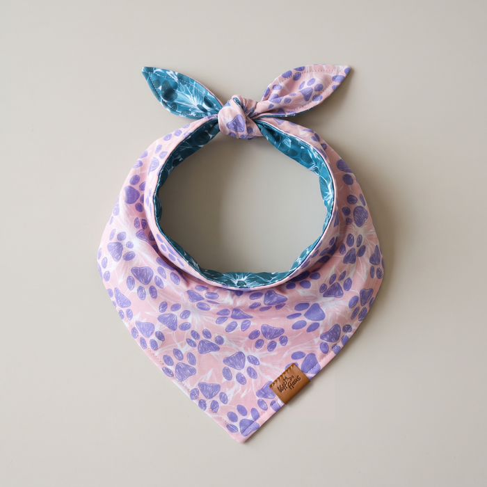 Floral Paws reversible dog bandana, Lilac Paws side, tied flat lay