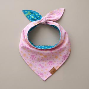 Pawprints & Love reversible dog bandana, Blush Paws side, tied flat lay