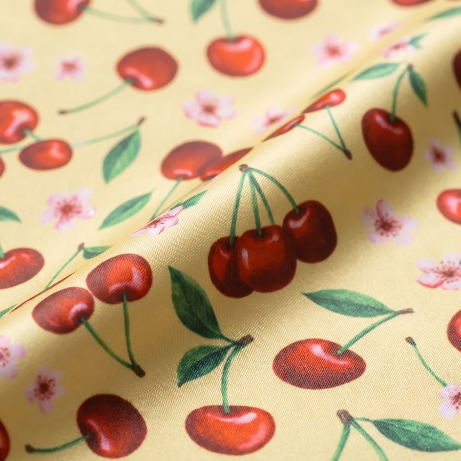 Close-up of the Cherry Pop bandana's printed fabric